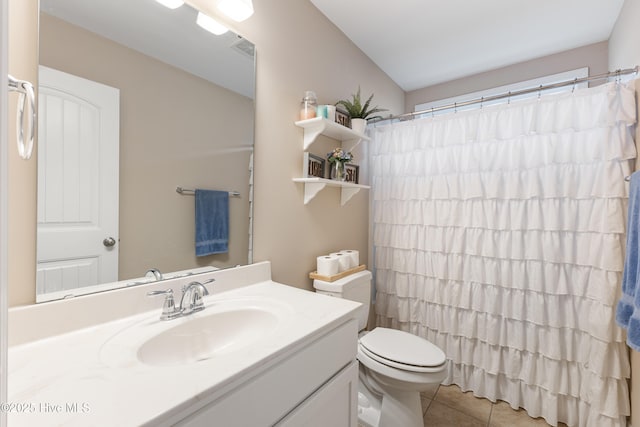 849 Rolling Pines Loop Rd, Leland, NC 28451 - bathroom featuring vanity, tile patterned flooring, toilet, and curtained shower