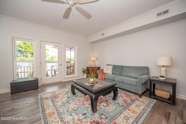 103 Continental Dr Unit 3, Elizabeth City, NC 27909 - living room featuring crown molding, plenty of natural light, wood finished floors, and a ceiling fan