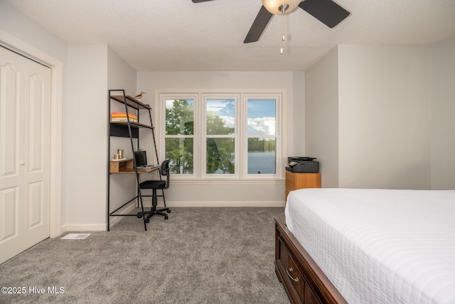 103 Continental Dr Unit 3, Elizabeth City, NC 27909 - carpeted bedroom featuring a desk, baseboards, a textured ceiling, and a ceiling fan