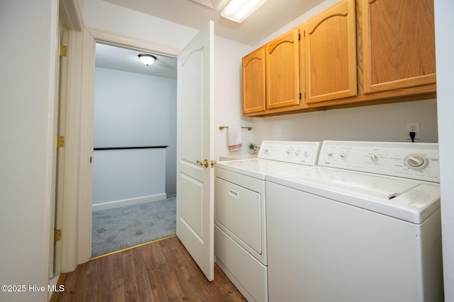 103 Continental Dr Unit 3, Elizabeth City, NC 27909 - laundry room with washer and dryer, cabinet space, and dark wood-style floors