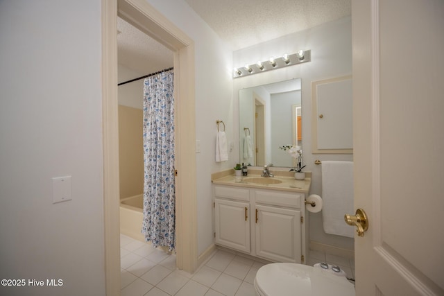103 Continental Dr Unit 3, Elizabeth City, NC 27909 - full bath with vanity, tile patterned flooring, toilet, shower / bath combination with curtain, and a textured ceiling