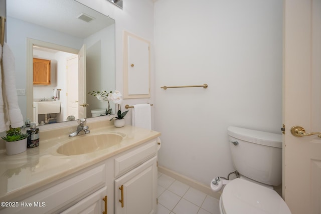 103 Continental Dr Unit 3, Elizabeth City, NC 27909 - half bathroom with toilet, tile patterned floors, baseboards, and vanity