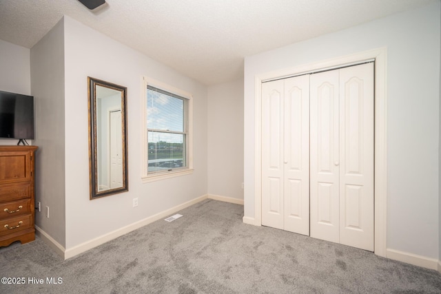 103 Continental Dr Unit 3, Elizabeth City, NC 27909 - unfurnished bedroom with carpet, a closet, and baseboards