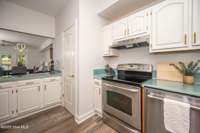 103 Continental Dr Unit 3, Elizabeth City, NC 27909 - kitchen with stainless steel appliances, under cabinet range hood, dark wood-style flooring, white cabinets, and baseboards