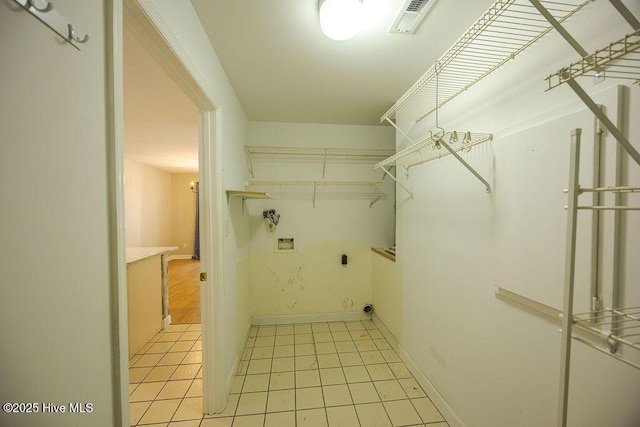421 Commerce Ave Unit B, Morehead City, NC 28557 - laundry area with hookup for an electric dryer, hookup for a washing machine, and baseboards