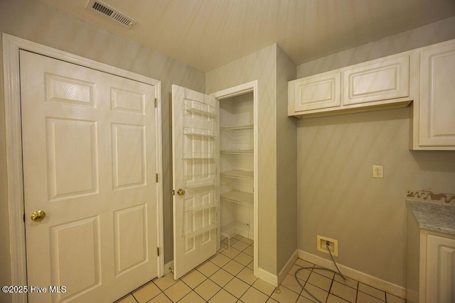 421 Commerce Ave Unit B, Morehead City, NC 28557 - laundry room featuring light tile patterned flooring and baseboards