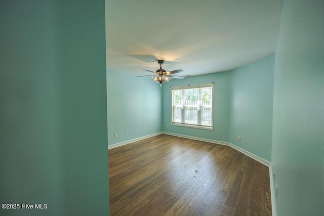 421 Commerce Ave Unit B, Morehead City, NC 28557 - unfurnished room with baseboards, dark wood-style floors, and a ceiling fan