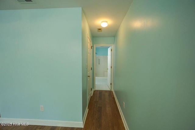 421 Commerce Ave Unit B, Morehead City, NC 28557 - hallway with dark wood-type flooring and baseboards