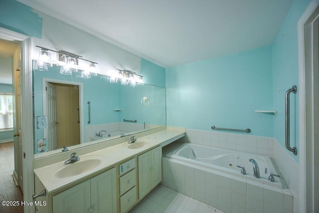 421 Commerce Ave Unit B, Morehead City, NC 28557 - full bath featuring a tub with jets, double vanity, and tile patterned flooring