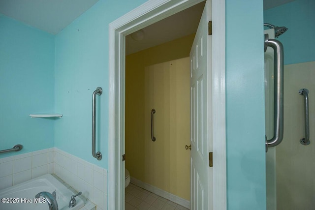 421 Commerce Ave Unit B, Morehead City, NC 28557 - bathroom with a bath, tile patterned floors, and toilet