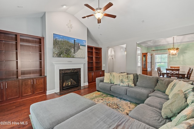 1678 Old Salt SW, Shallotte, NC 28470 - living room with ceiling fan, dark wood-style flooring, a premium fireplace, high vaulted ceiling, and a chandelier