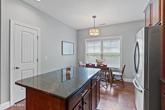 1678 Old Salt SW, Shallotte, NC 28470 - kitchen featuring freestanding refrigerator, baseboards, wood finished floors, pendant lighting, and a kitchen island