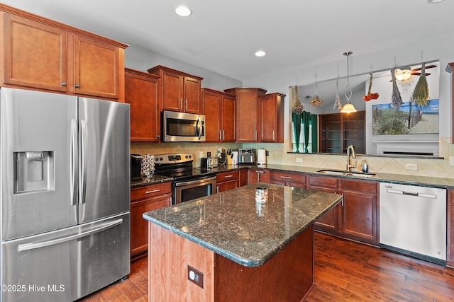 1678 Old Salt SW, Shallotte, NC 28470 - kitchen with stainless steel appliances, a sink, backsplash, a center island, and recessed lighting