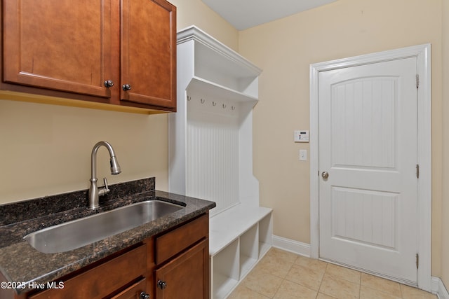 1678 Old Salt SW, Shallotte, NC 28470 - mudroom with a sink, light tile patterned floors, and baseboards