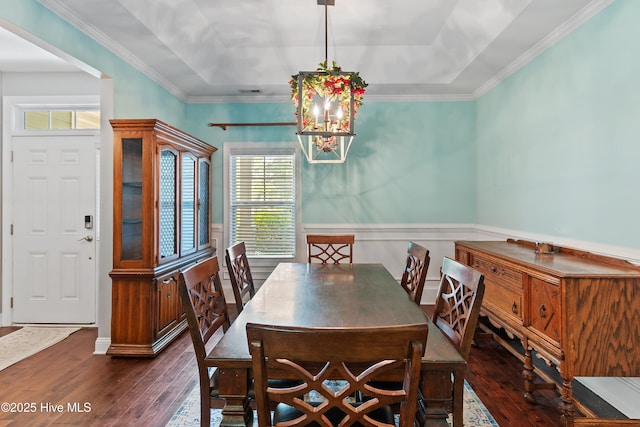 1678 Old Salt SW, Shallotte, NC 28470 - dining area featuring healthy amount of natural light, hardwood / wood-style flooring, a chandelier, a raised ceiling, and wainscoting