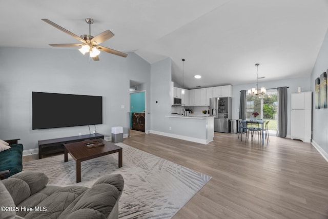 1014 Ponderosa Pl, Jacksonville, NC 28546 - living area with a chandelier, lofted ceiling, ceiling fan, light wood-type flooring, and baseboards