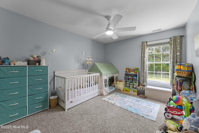 1014 Ponderosa Pl, Jacksonville, NC 28546 - bedroom featuring carpet, a crib, and ceiling fan