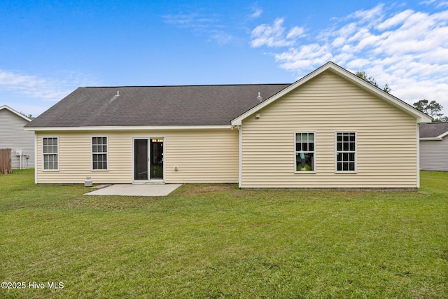 1014 Ponderosa Pl, Jacksonville, NC 28546 - back of property with a patio area, a yard, and roof with shingles