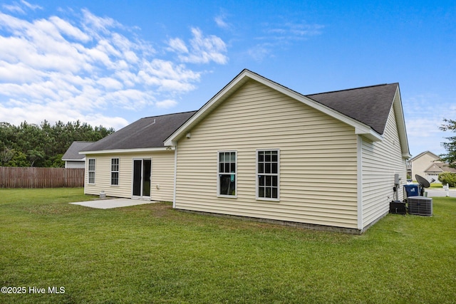 1014 Ponderosa Pl, Jacksonville, NC 28546 - back of property with a patio, a shingled roof, and central air condition unit