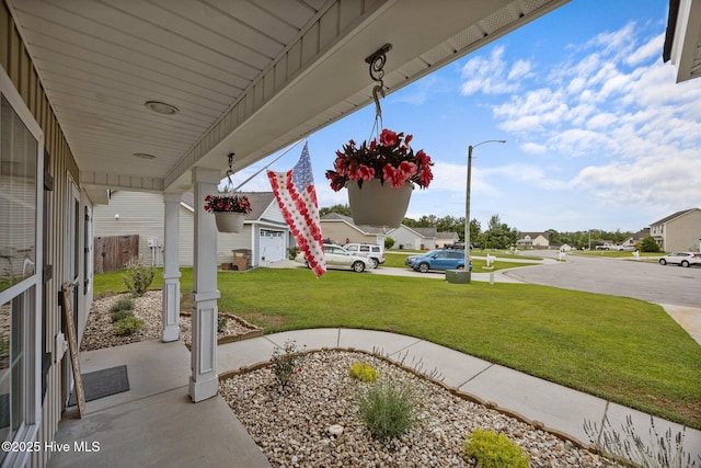 1014 Ponderosa Pl, Jacksonville, NC 28546 - porch featuring a lawn and a residential view