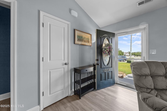 1014 Ponderosa Pl, Jacksonville, NC 28546 - foyer entrance with vaulted ceiling, light wood-style floors, and baseboards