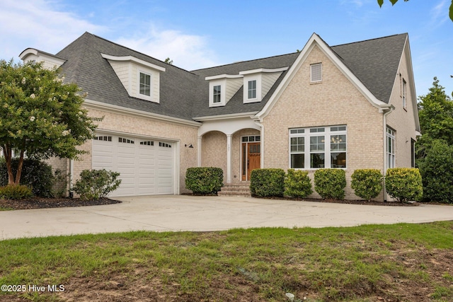 137 Summerset Lndg, Hampstead, NC 28443 - view of front of property featuring driveway, brick siding, and a shingled roof