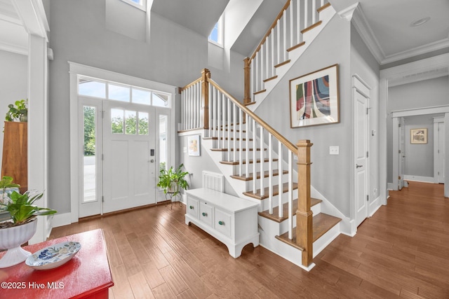 137 Summerset Lndg, Hampstead, NC 28443 - foyer with ornamental molding, wood finished floors, stairs, and a towering ceiling
