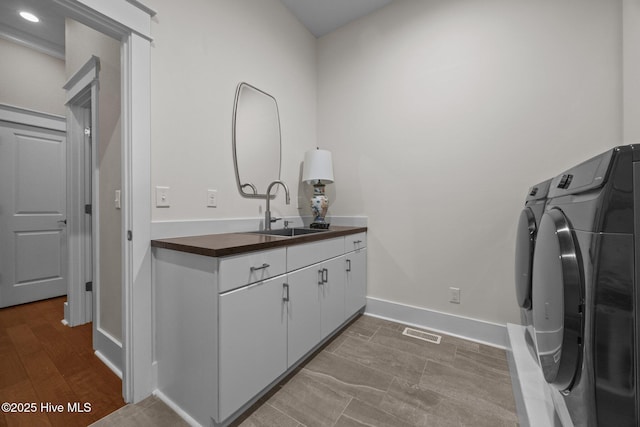 137 Summerset Lndg, Hampstead, NC 28443 - laundry area with independent washer and dryer, cabinet space, and recessed lighting