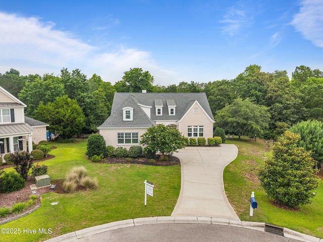 137 Summerset Lndg, Hampstead, NC 28443 - view of front facade featuring concrete driveway and a front yard