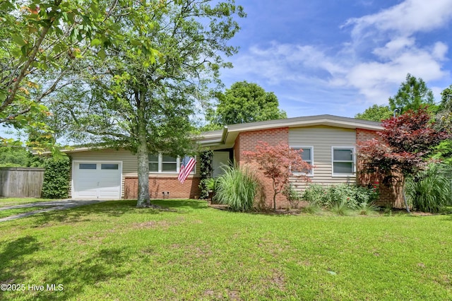 408 N 25th St, Wilmington, NC 28405 - view of front of house featuring brick siding, asphalt driveway, and an attached garage