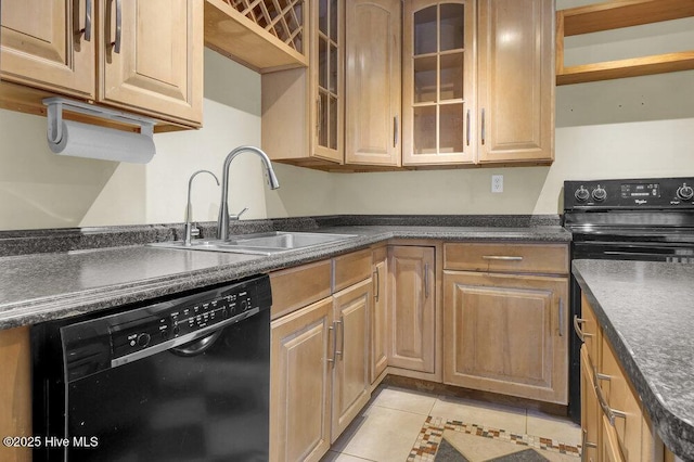408 N 25th St, Wilmington, NC 28405 - kitchen with dishwasher, a sink, dark countertops, range, and light tile patterned flooring
