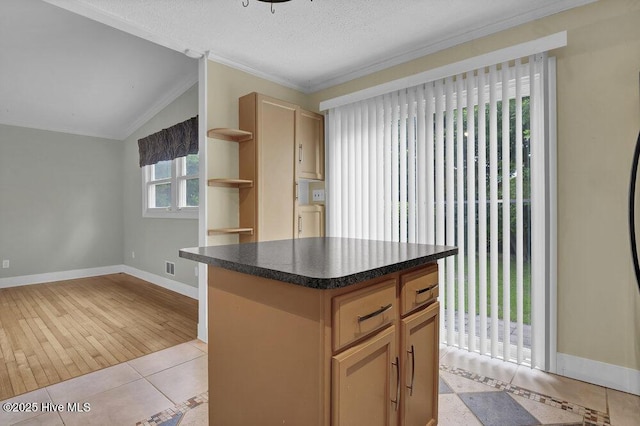 408 N 25th St, Wilmington, NC 28405 - kitchen featuring open shelves, baseboards, a kitchen island, dark countertops, and light tile patterned floors