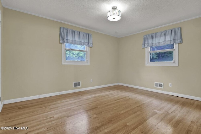 408 N 25th St, Wilmington, NC 28405 - unfurnished room featuring ornamental molding, wood finished floors, a textured ceiling, and baseboards