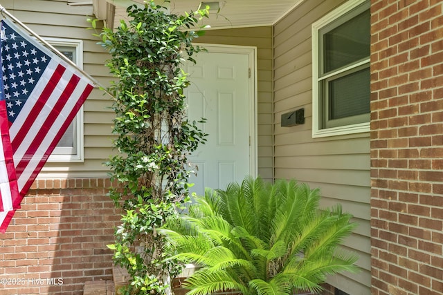 408 N 25th St, Wilmington, NC 28405 - doorway to property featuring brick siding