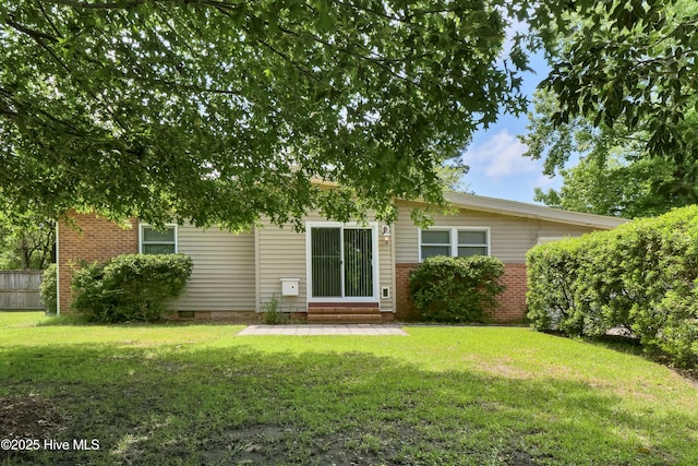408 N 25th St, Wilmington, NC 28405 - back of house featuring a lawn, brick siding, crawl space, and entry steps