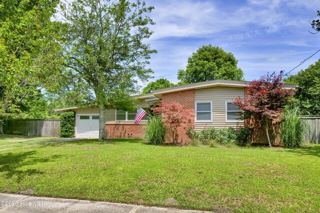 408 N 25th St, Wilmington, NC 28405 - view of front facade with a garage, brick siding, and driveway