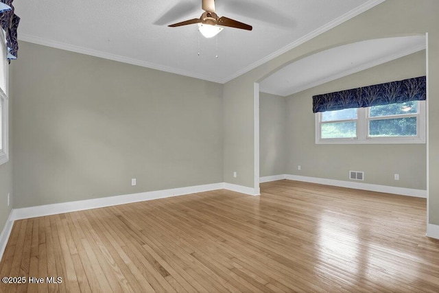 408 N 25th St, Wilmington, NC 28405 - spare room with light wood finished floors, arched walkways, a ceiling fan, baseboards, and crown molding