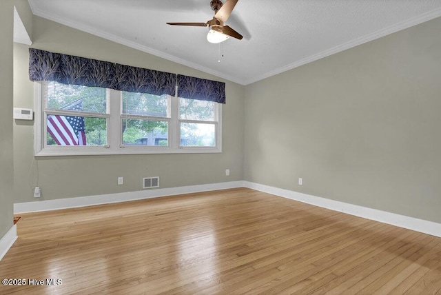 408 N 25th St, Wilmington, NC 28405 - spare room featuring light wood-type flooring, ceiling fan, vaulted ceiling, baseboards, and ornamental molding