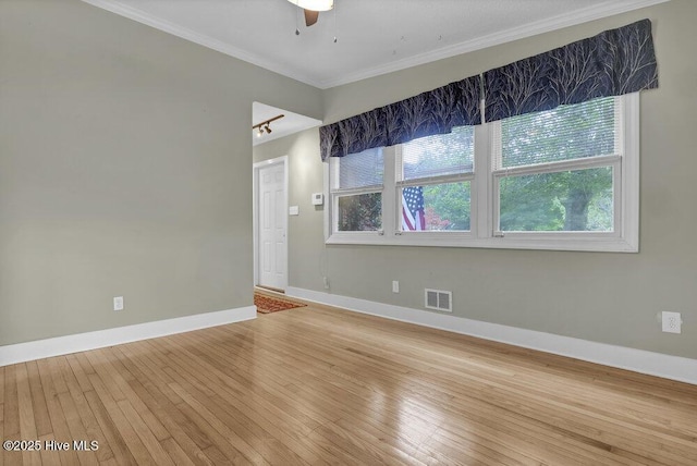 408 N 25th St, Wilmington, NC 28405 - empty room with crown molding, light wood-style flooring, baseboards, and ceiling fan