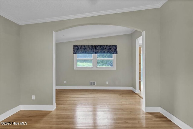 408 N 25th St, Wilmington, NC 28405 - empty room with arched walkways, wood-type flooring, baseboards, and ornamental molding