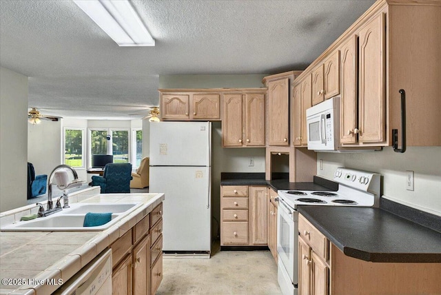 5685 Watts Rd SW, Ocean Isle Beach, NC 28469 - kitchen with white appliances, a sink, ceiling fan, a textured ceiling, and light brown cabinetry
