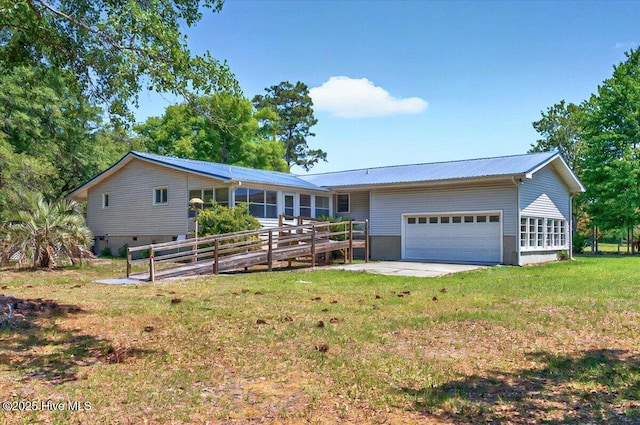 5685 Watts Rd SW, Ocean Isle Beach, NC 28469 - single story home featuring a garage, a front lawn, metal roof, and a sunroom