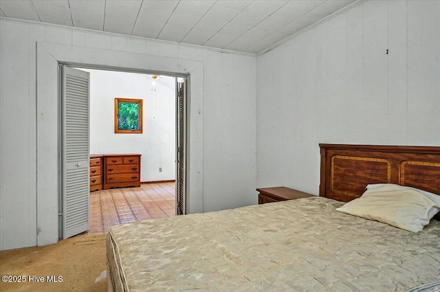 5685 Watts Rd SW, Ocean Isle Beach, NC 28469 - carpeted bedroom with ornamental molding and wooden walls
