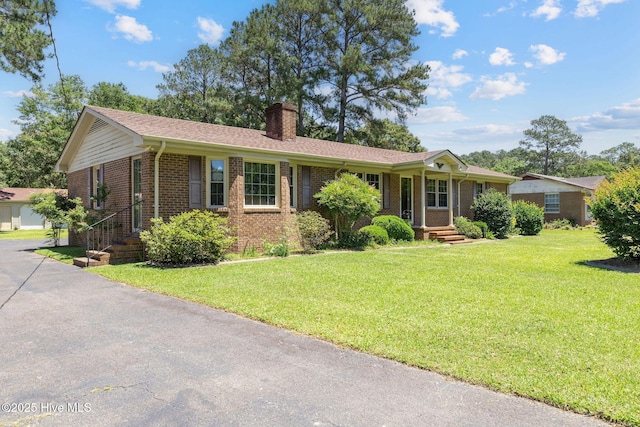263 La Grange Rd, La Grange, NC 28551 - single story home with brick siding, a chimney, and a front lawn
