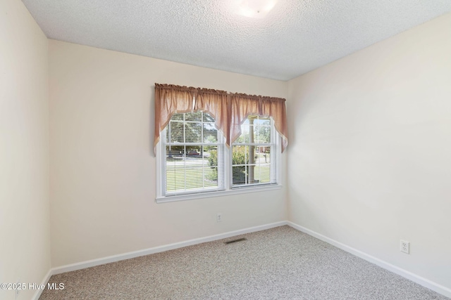 263 La Grange Rd, La Grange, NC 28551 - carpeted empty room featuring baseboards and a textured ceiling