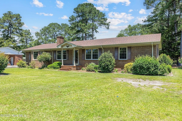 263 La Grange Rd, La Grange, NC 28551 - single story home featuring brick siding, a chimney, and a front yard