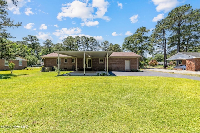 263 La Grange Rd, La Grange, NC 28551 - view of front of house with a front yard, driveway, and brick siding