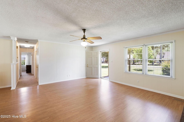 263 La Grange Rd, La Grange, NC 28551 - spare room featuring light wood-style floors, crown molding, plenty of natural light, ceiling fan, and a textured ceiling