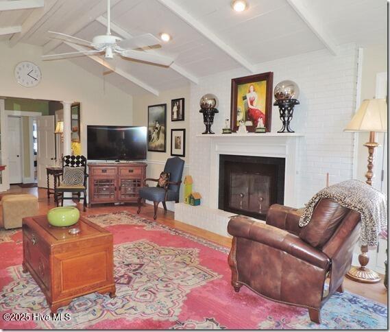 110 E Blalock Rd, Lucama, NC 27851 - living room featuring a ceiling fan and a fireplace