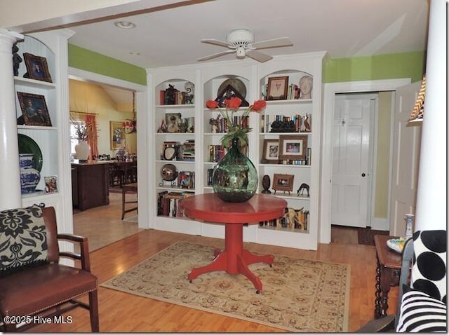 110 E Blalock Rd, Lucama, NC 27851 - living area with wood finished floors, a ceiling fan, and built in shelves